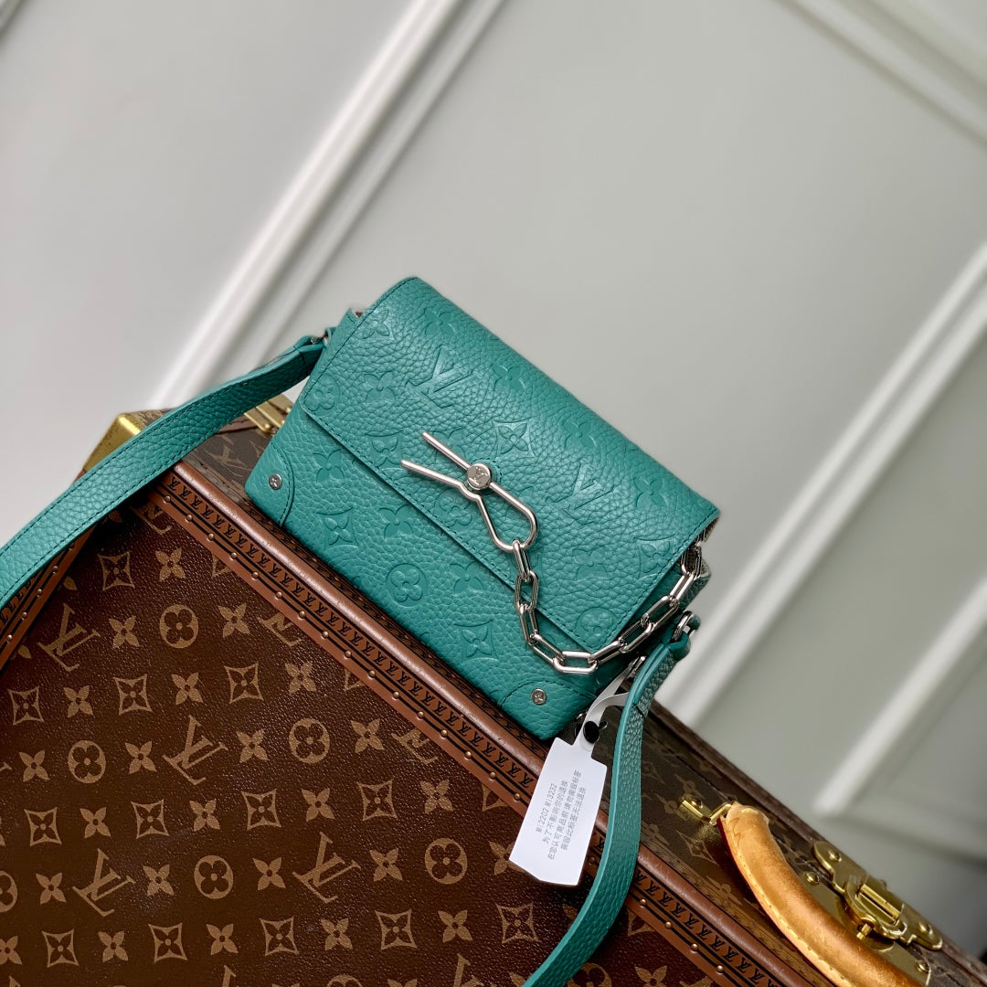 STEAMER WEARABLE WALLET 18 IN TEAL GREEN MONOGRAM TAURILLON CALFSKIN