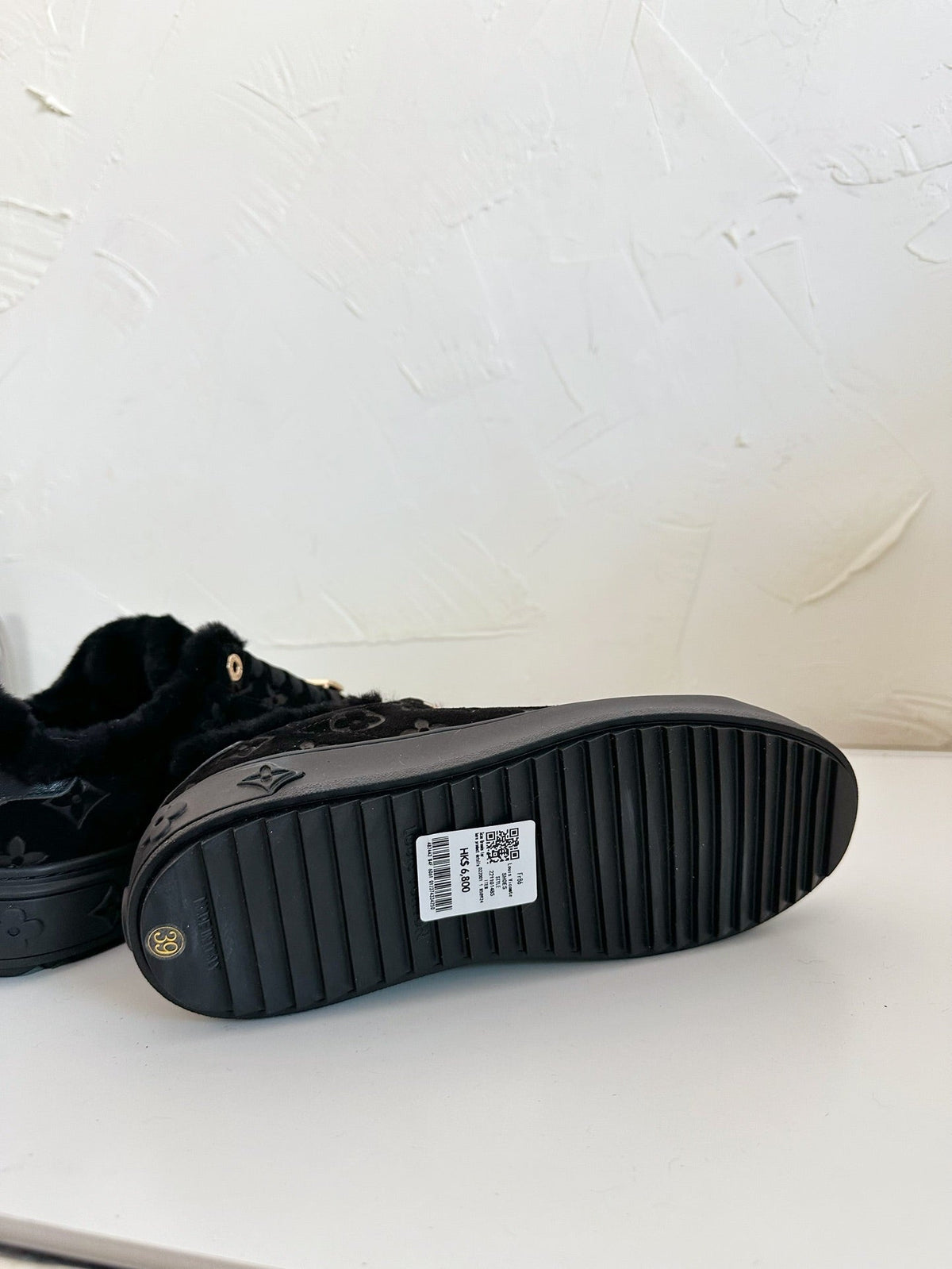 TIME OUT SNEAKER IN BLACK MONOGRAM EMBOSSED SUEDE WITH FLEECE LINING