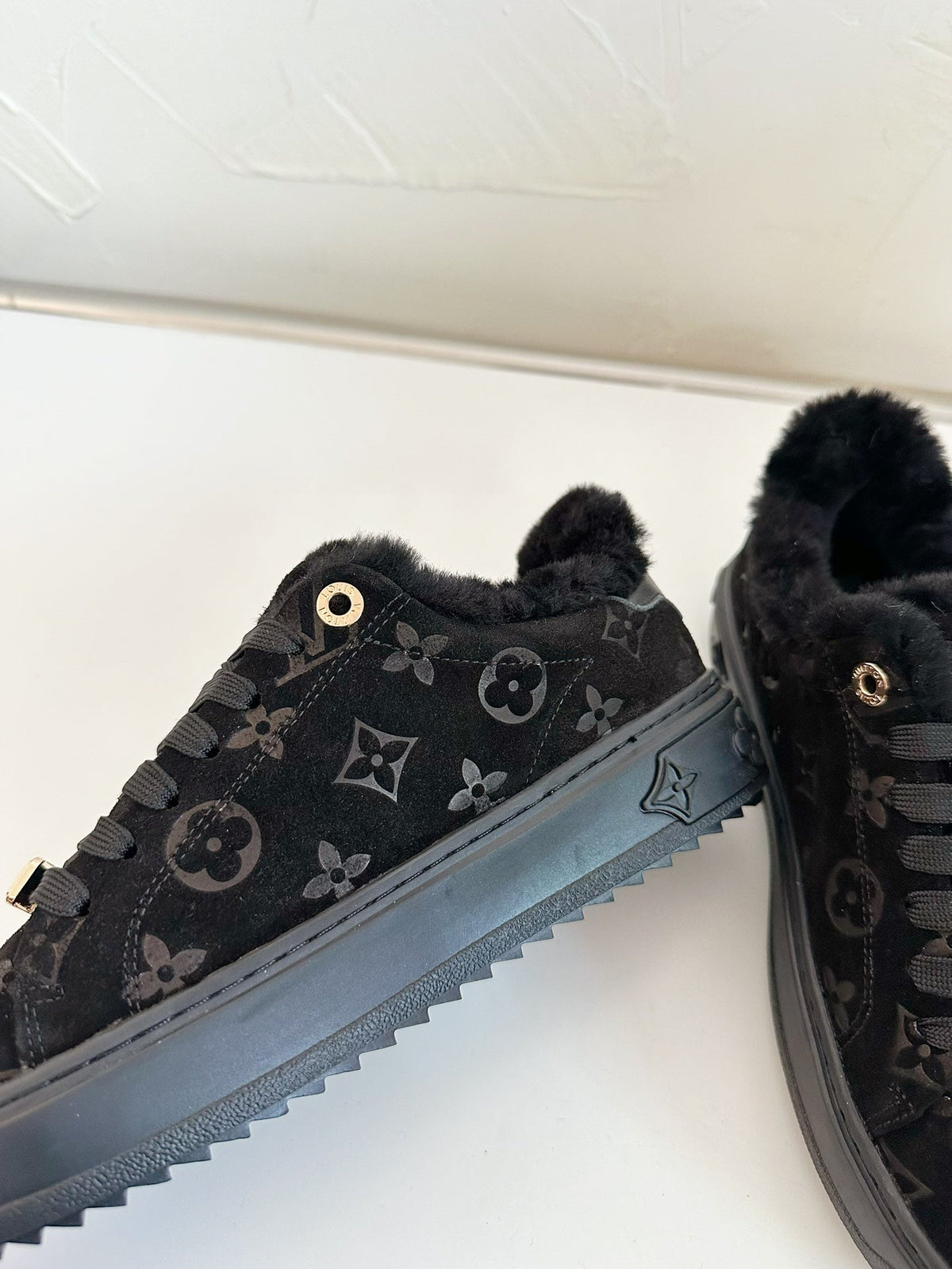 TIME OUT SNEAKER IN BLACK MONOGRAM EMBOSSED SUEDE WITH FLEECE LINING