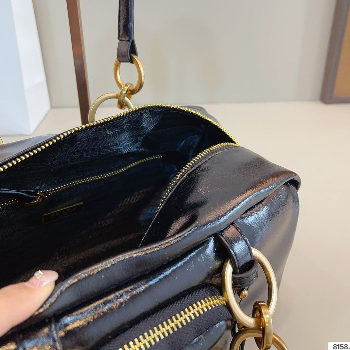 DANGLE TOP HANDLE BAG 30 IN BLACK PATENT CALFSKIN