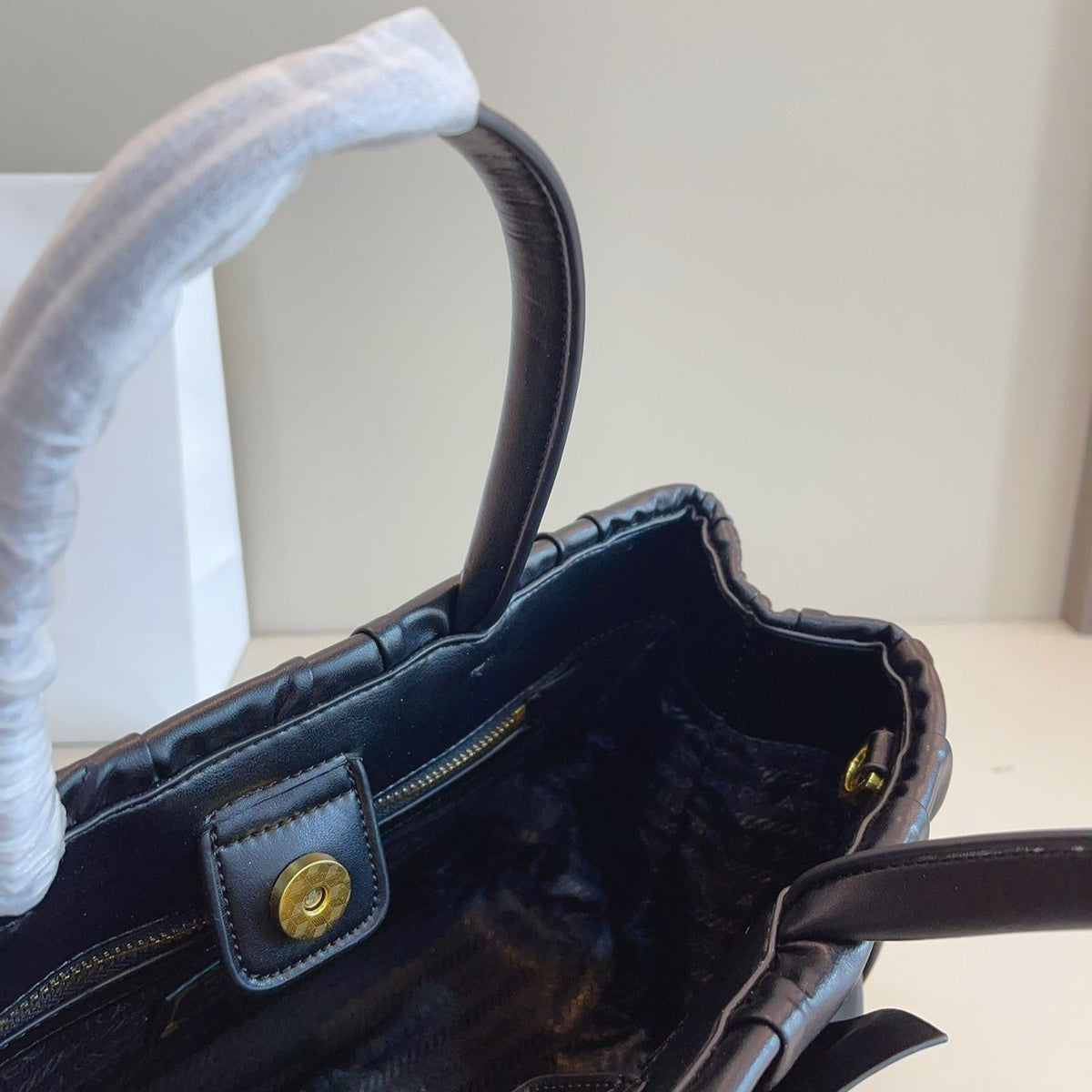 BOW DETAIL RUCHED TOP HANDLE BAG 29 IN BLACK SAFFIANO LEATHER