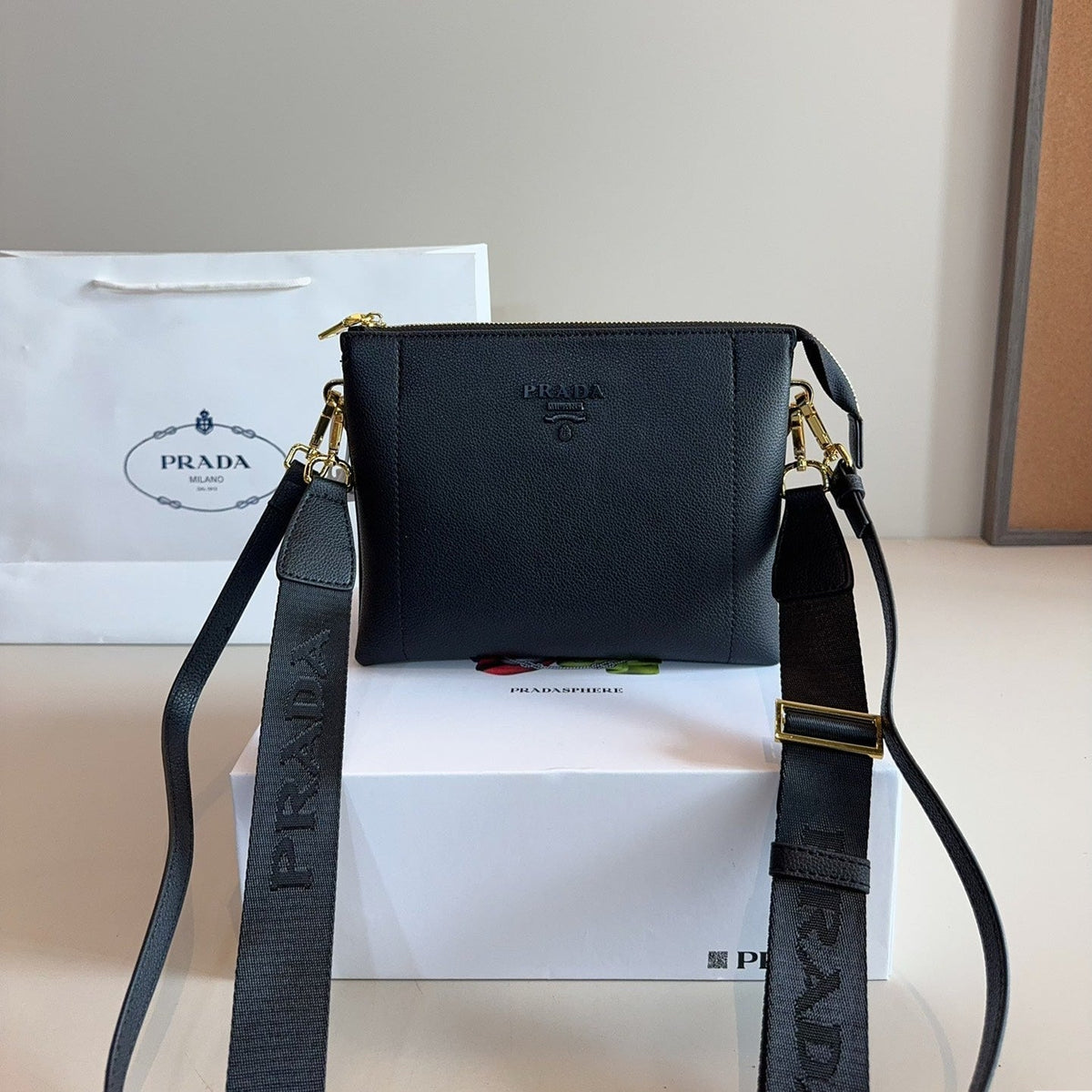 EMBOSSED LOGO HOBO SHOULDER BAG 23 IN BLACK SHINY SAFFIANO LEATHER