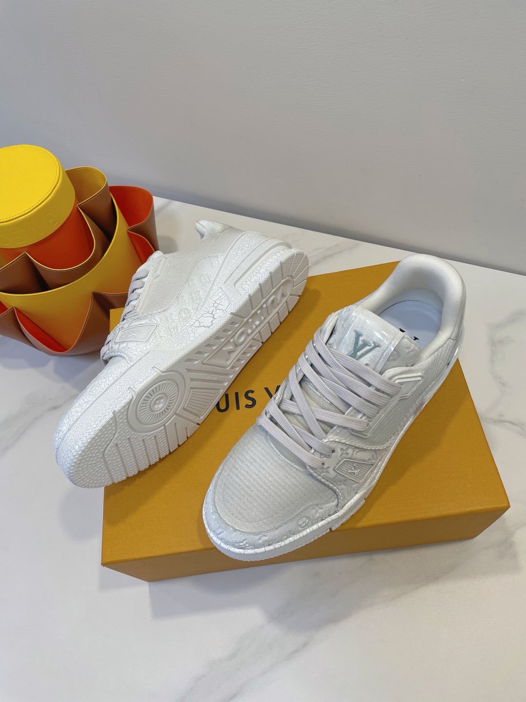 LV TRAINER MAXI SNEAKER IN WHITE EMBOSSED CALFSKIN