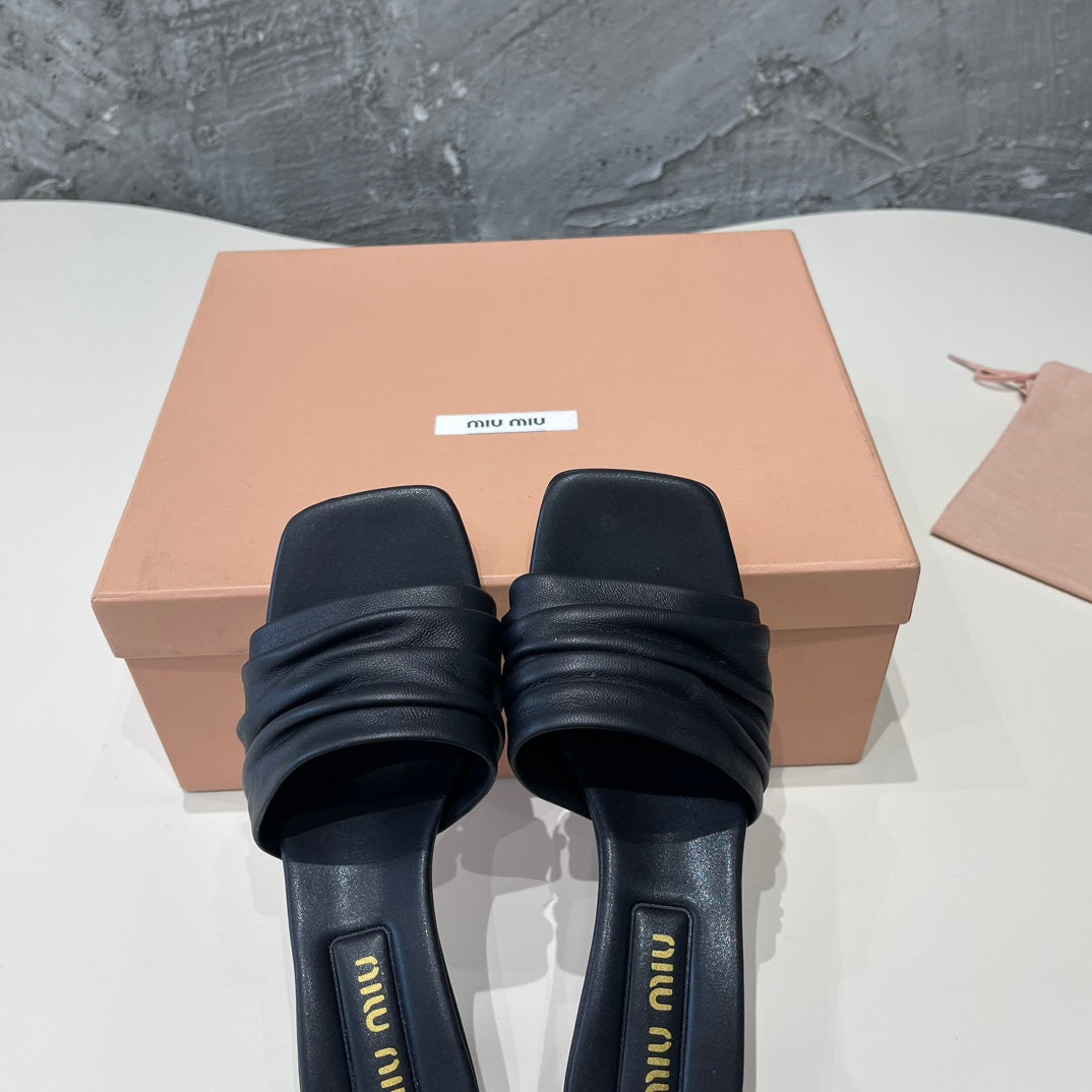 HIGH - HEEL BLACK SHEEPSKIN WITH STYLIZED STRAPS