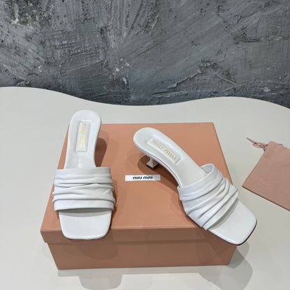 HIGH - HEEL WHITE SHEEPSKIN WITH STYLIZED STRAPS