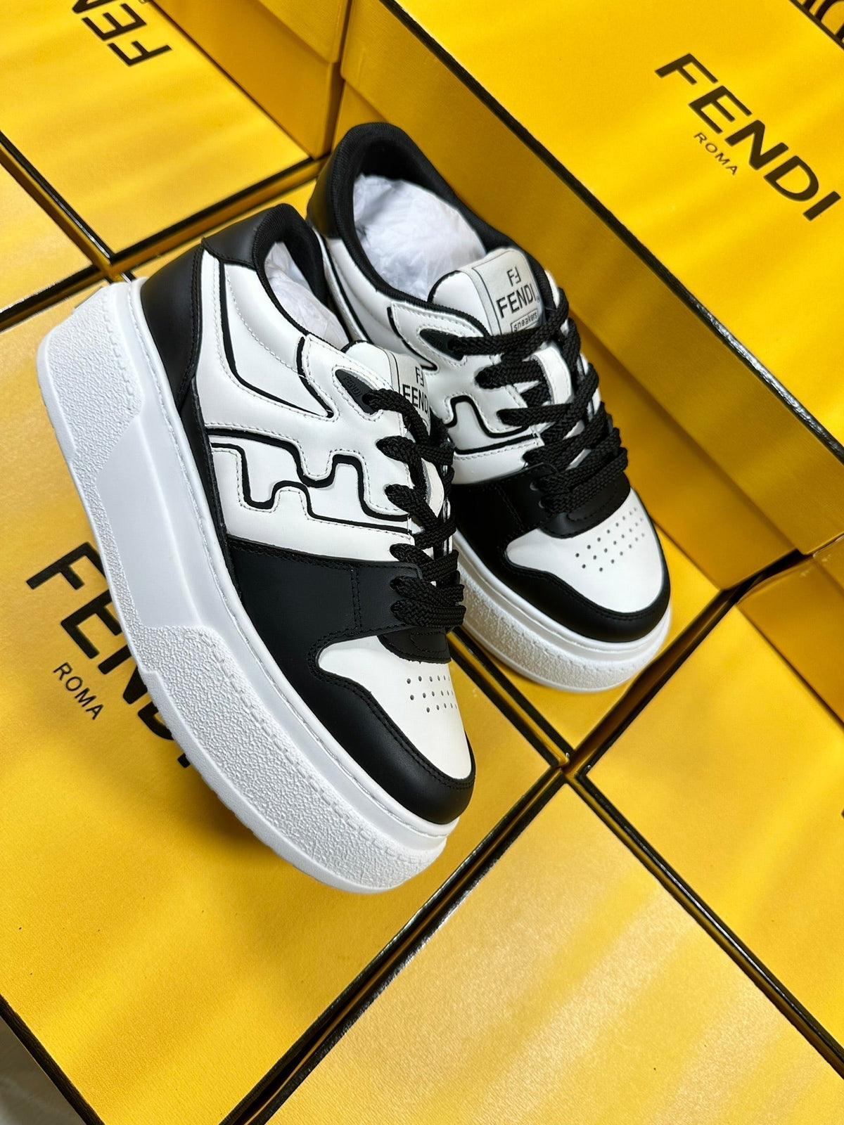 FENDI THICK-SOLDED SNEAKER IN WHITE AND BLACK LAMBSKIN