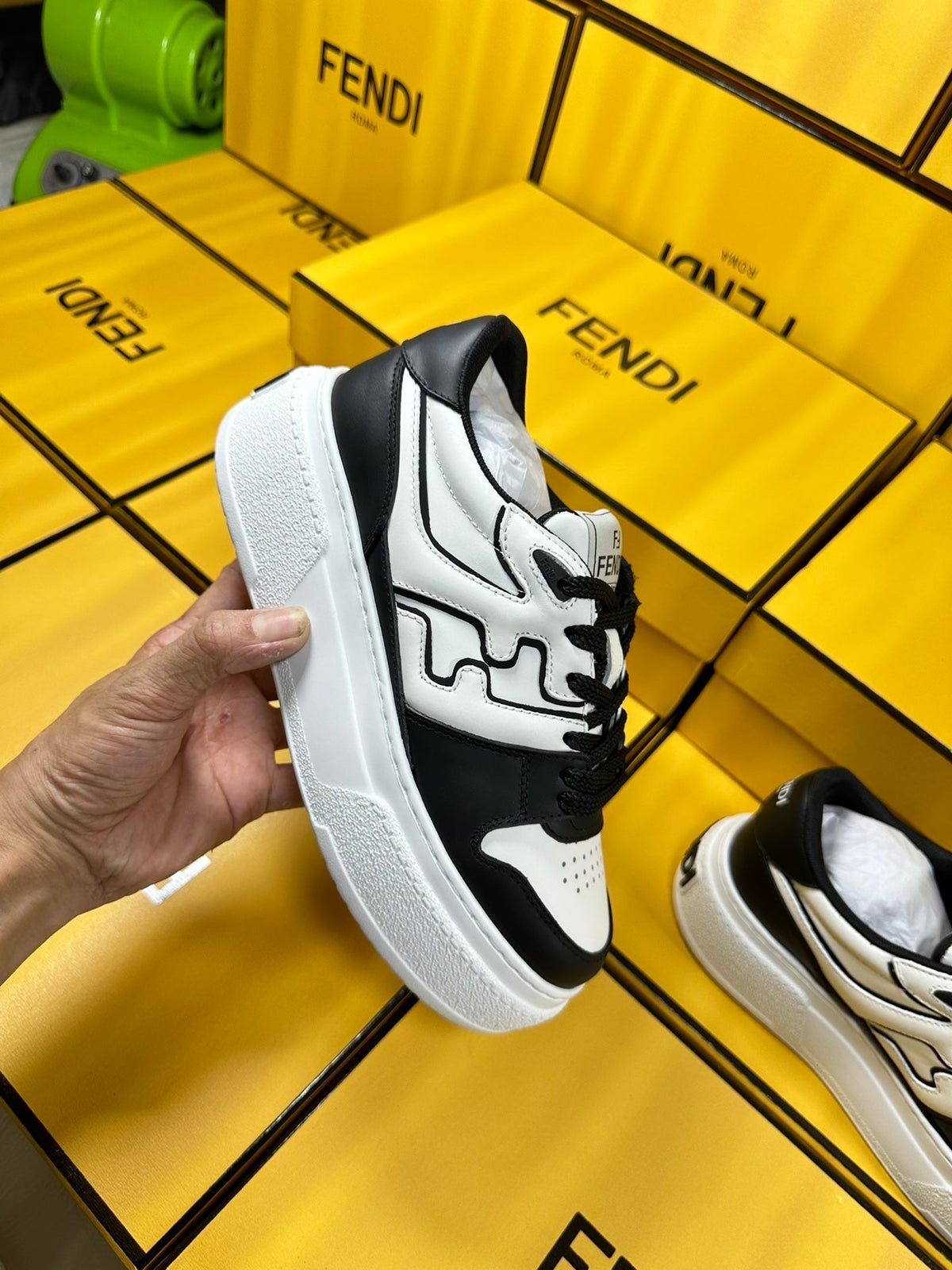 FENDI THICK-SOLDED SNEAKER IN WHITE AND BLACK LAMBSKIN