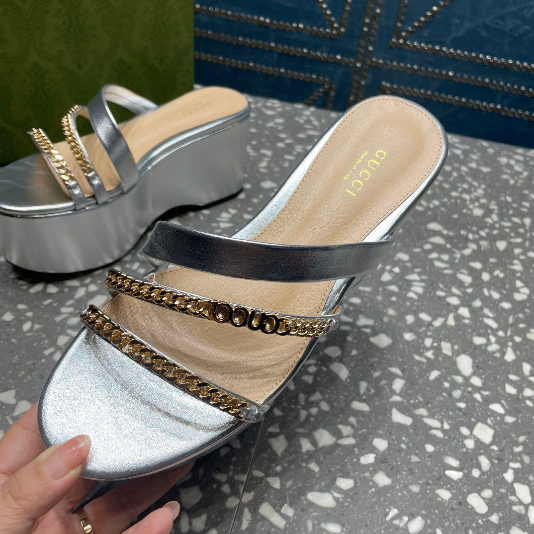 HIGH WEDGE PLATFORM IN SILVER CALFSKIN WITH GOLD HARDWARE