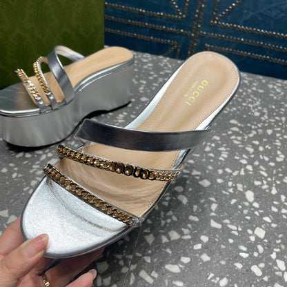 HIGH WEDGE PLATFORM IN SILVER CALFSKIN WITH GOLD HARDWARE