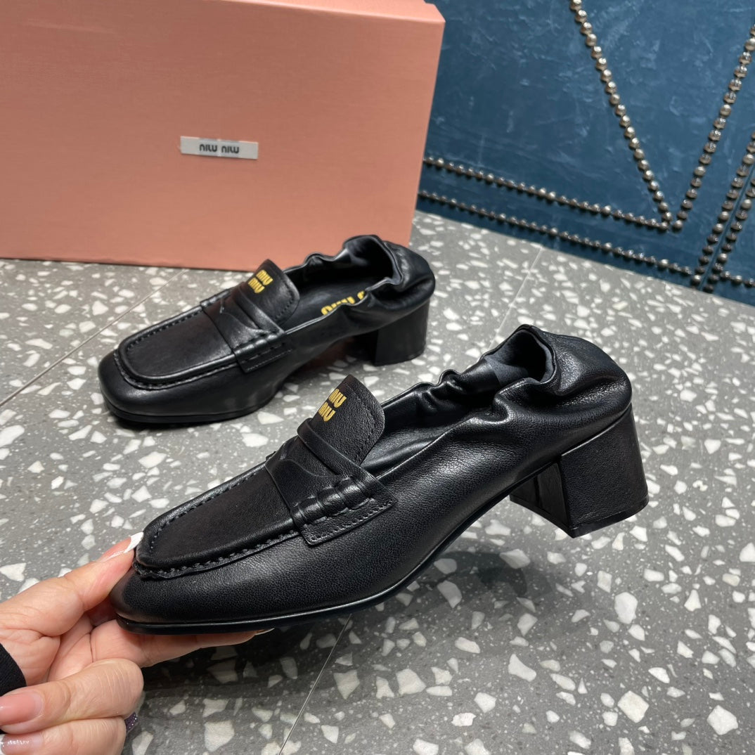 HIGH BROGUE LOAFERS IN BLACK LAMBSKIN