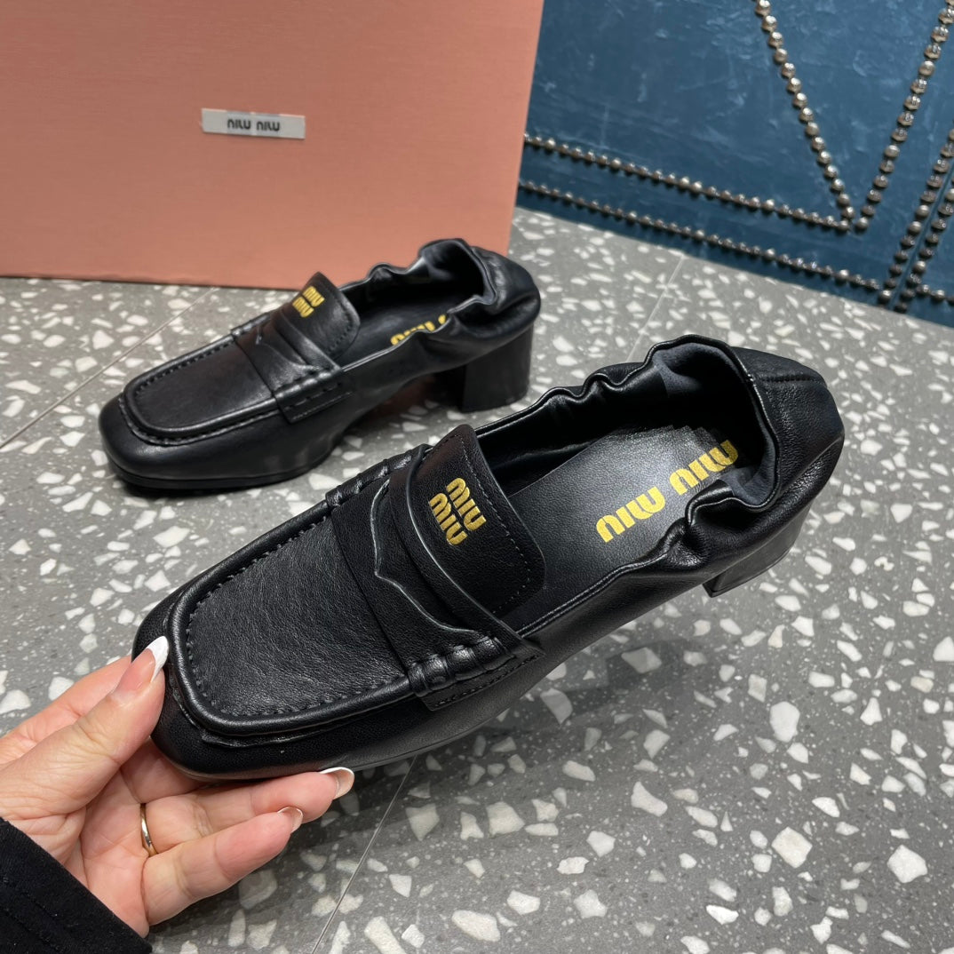 HIGH BROGUE LOAFERS IN BLACK LAMBSKIN