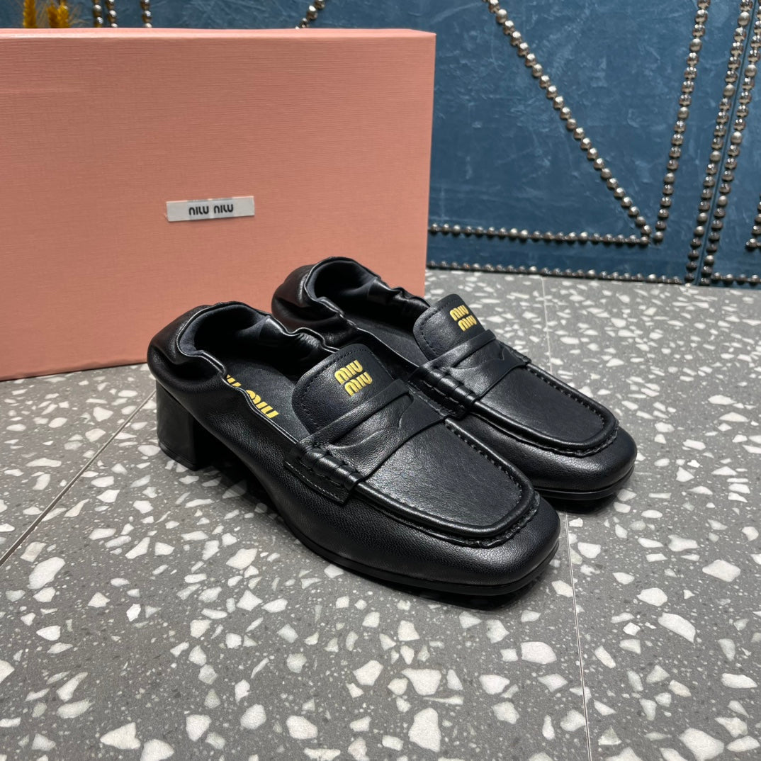 HIGH BROGUE LOAFERS IN BLACK LAMBSKIN