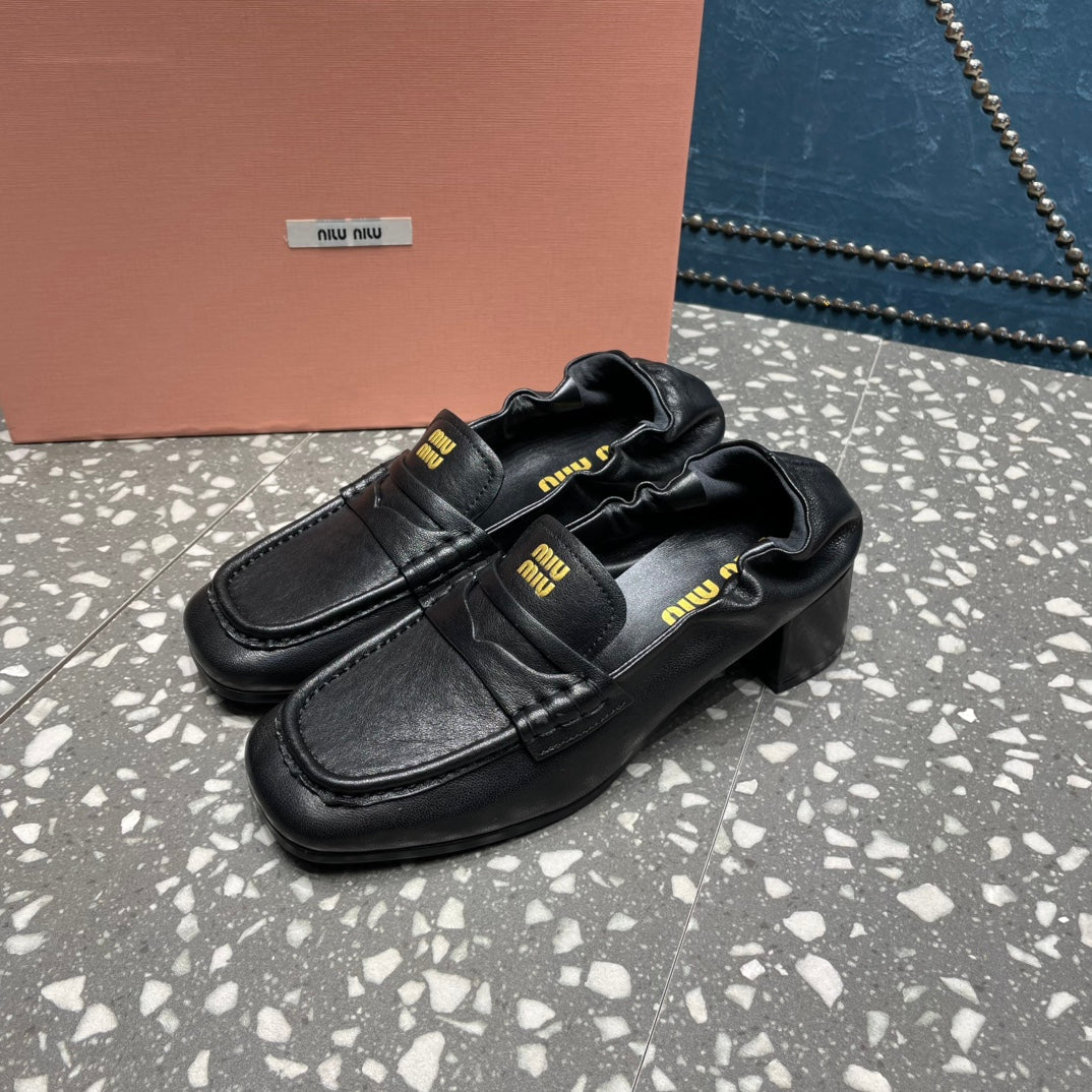 HIGH BROGUE LOAFERS IN BLACK LAMBSKIN