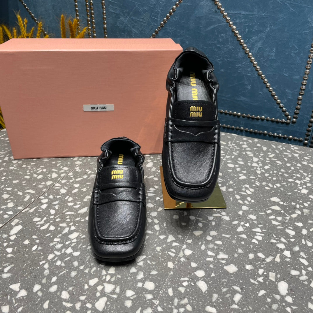 HIGH BROGUE LOAFERS IN BLACK LAMBSKIN