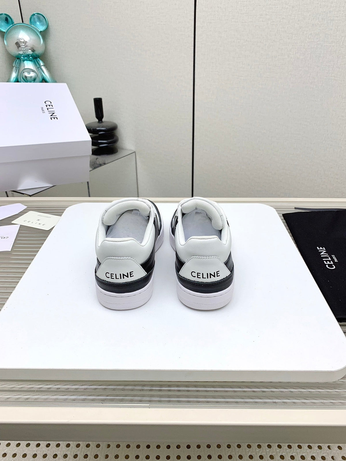 SNEAKER WITH TRIOMPHE IN BLACK AND WHITE CALFSKIN