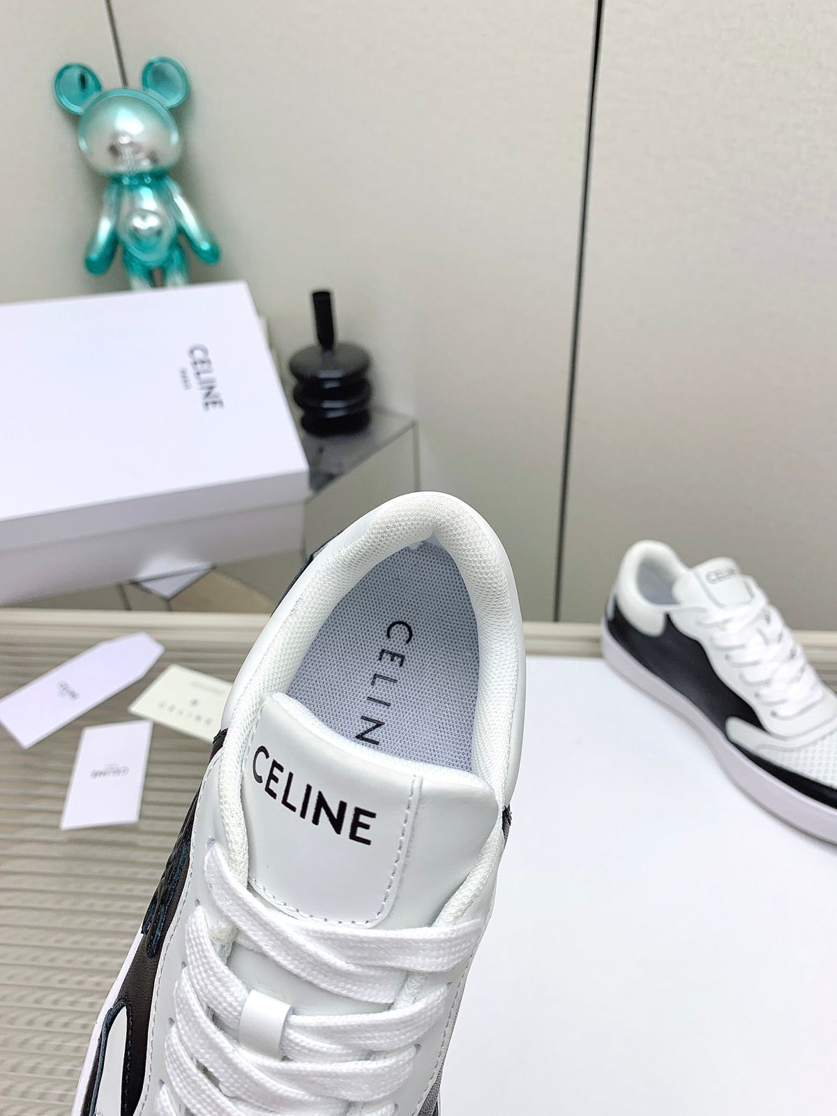 SNEAKER WITH TRIOMPHE IN BLACK AND WHITE CALFSKIN