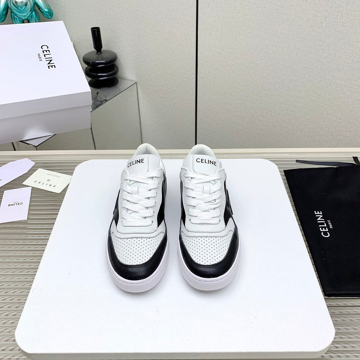 SNEAKER WITH TRIOMPHE IN BLACK AND WHITE CALFSKIN