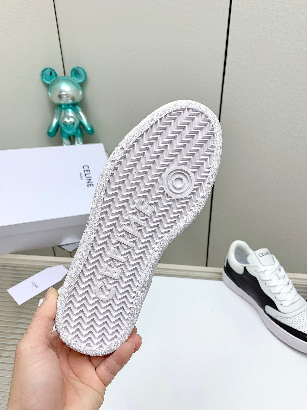 SNEAKER WITH TRIOMPHE IN BLACK AND WHITE CALFSKIN