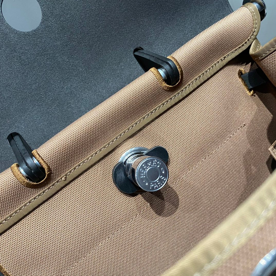 HERBAG A DOS ZIP RETOURNE BACKPACK 29 IN BROWN CANVAS AND BLACK CALFSKIN