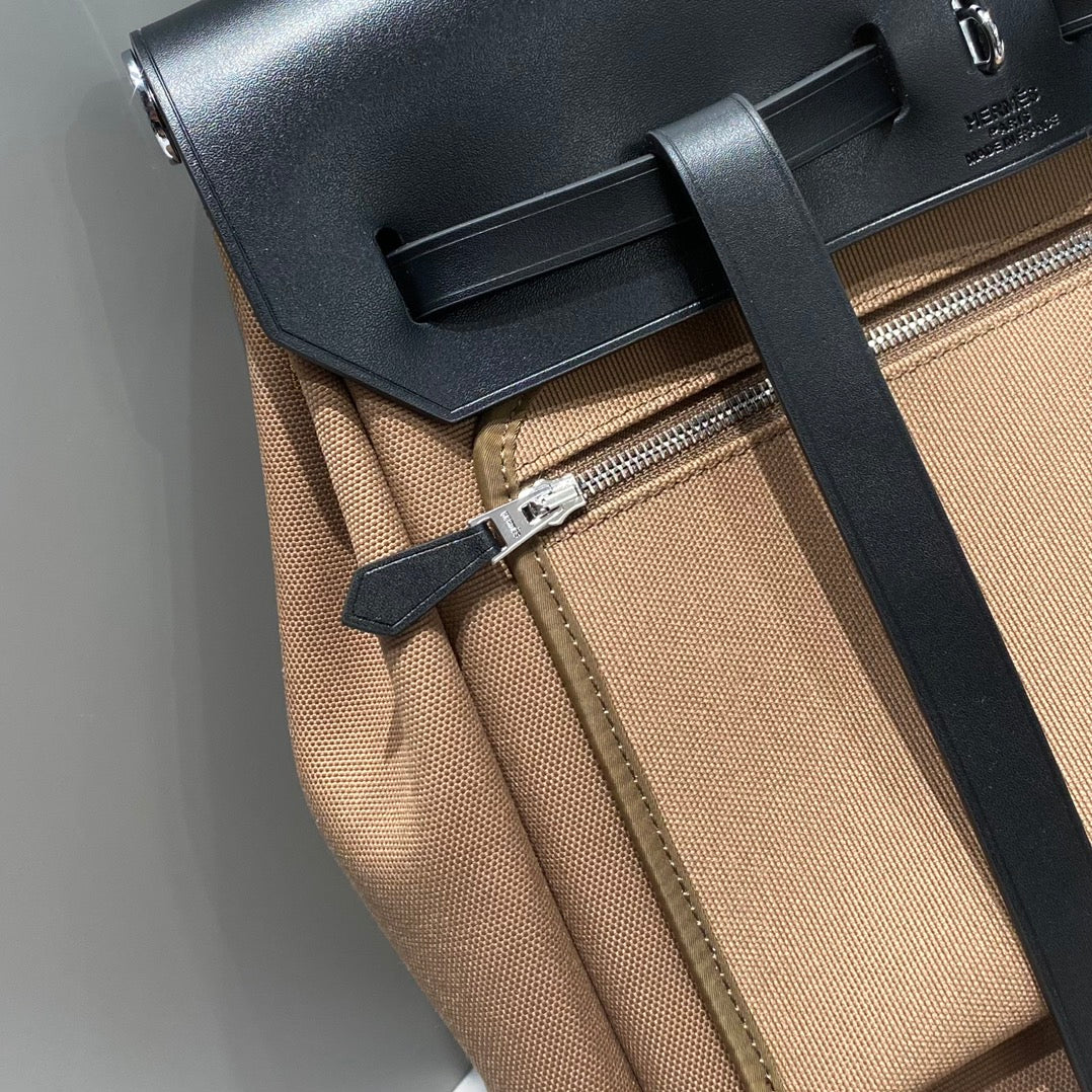 HERBAG A DOS ZIP RETOURNE BACKPACK 29 IN BROWN CANVAS AND BLACK CALFSKIN