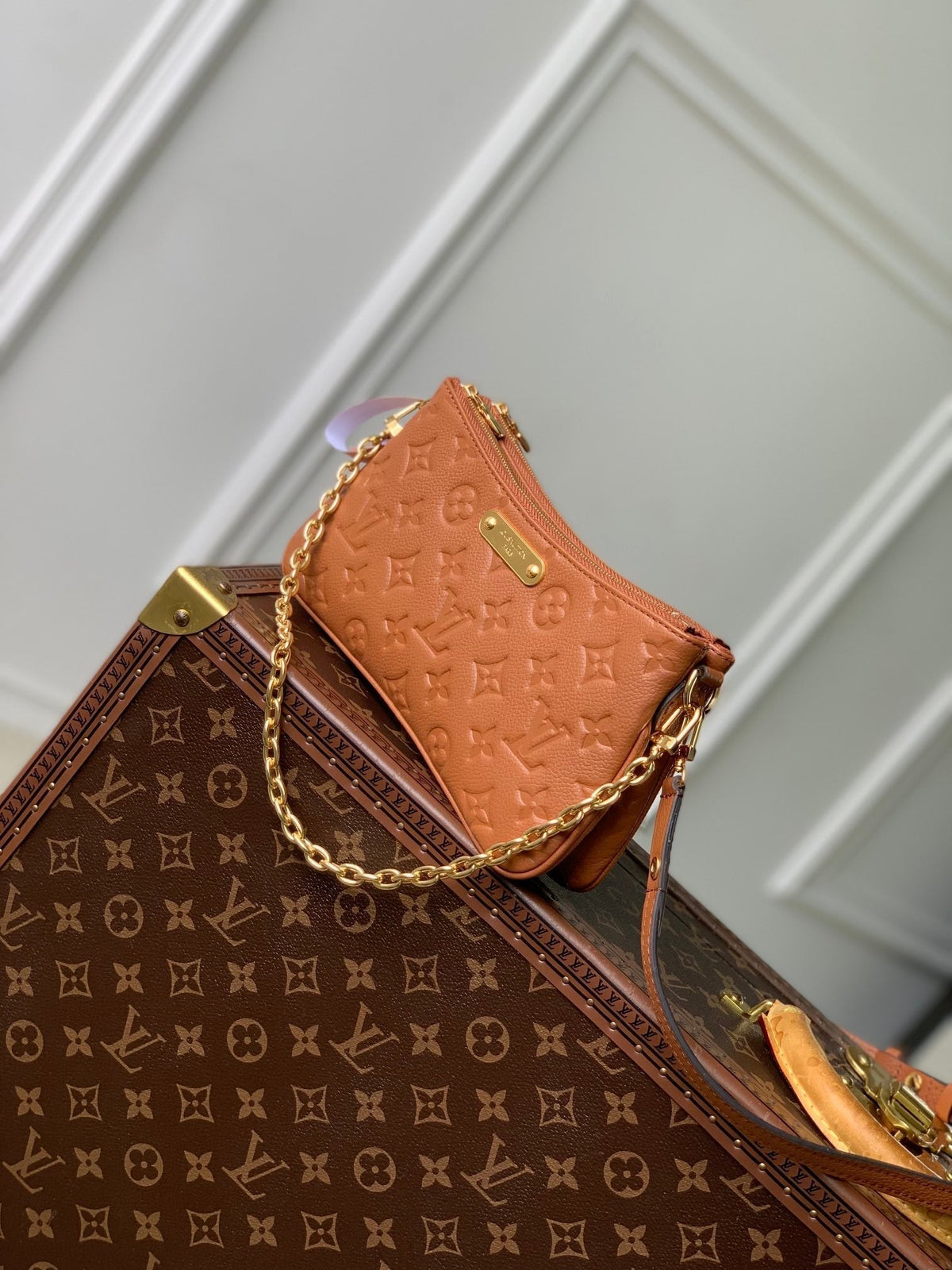 LIV POCHETTE BAG 24 IN COGNAC BROWN MONOGRAM EMPREINTE LEATHER