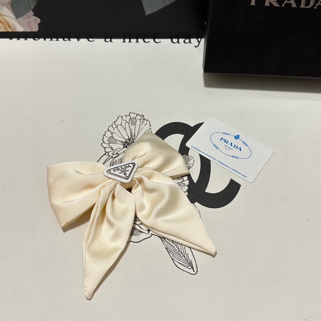 BOW-KNOT HAIR CLIP IN EGG SHELL SILK 358294