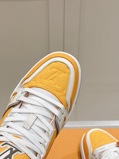 LV TRAINER SNEAKER IN SAFFRAN YELLOW GRAINED CALFSKIN