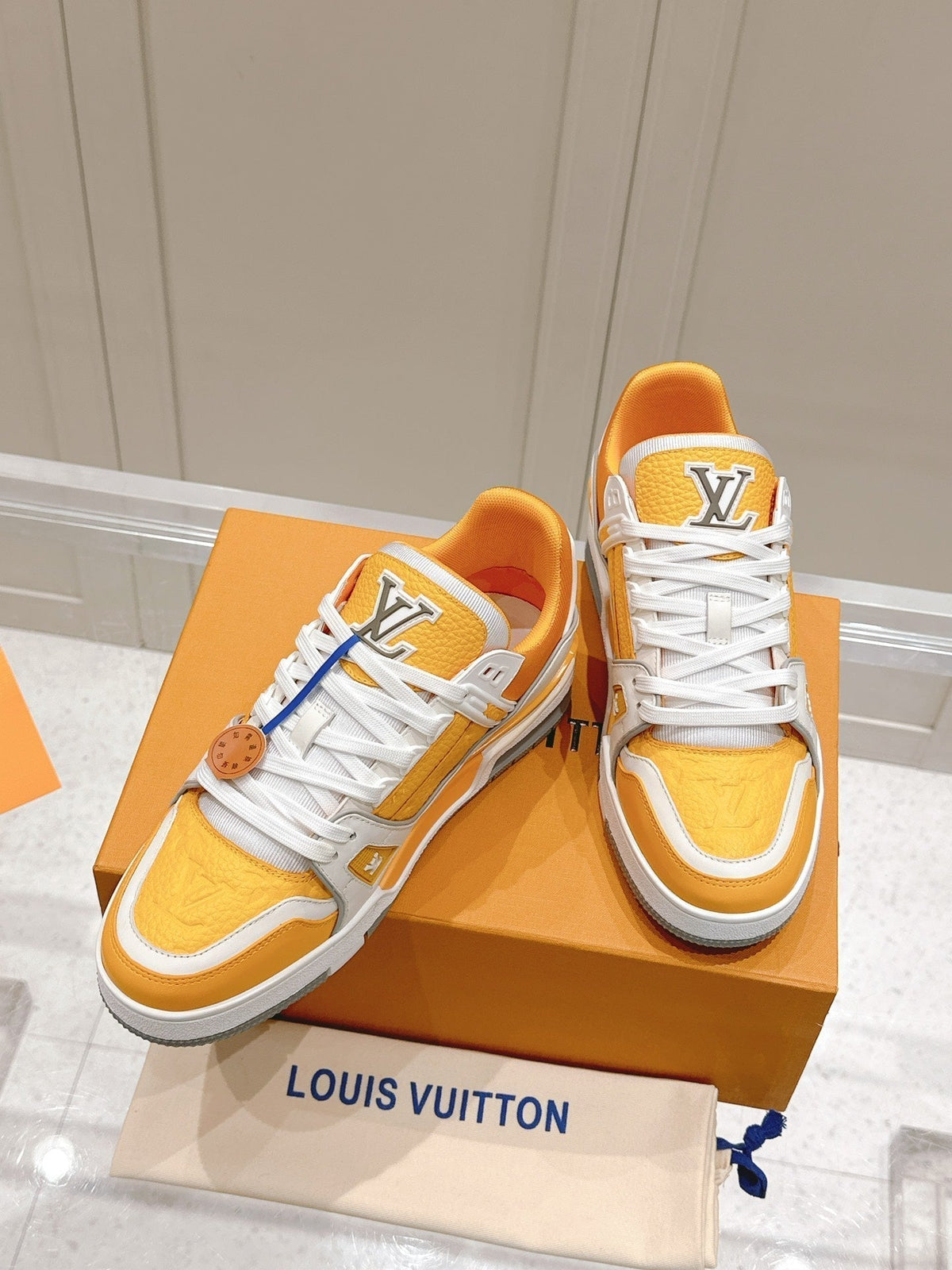 LV TRAINER SNEAKER IN SAFFRAN YELLOW GRAINED CALFSKIN