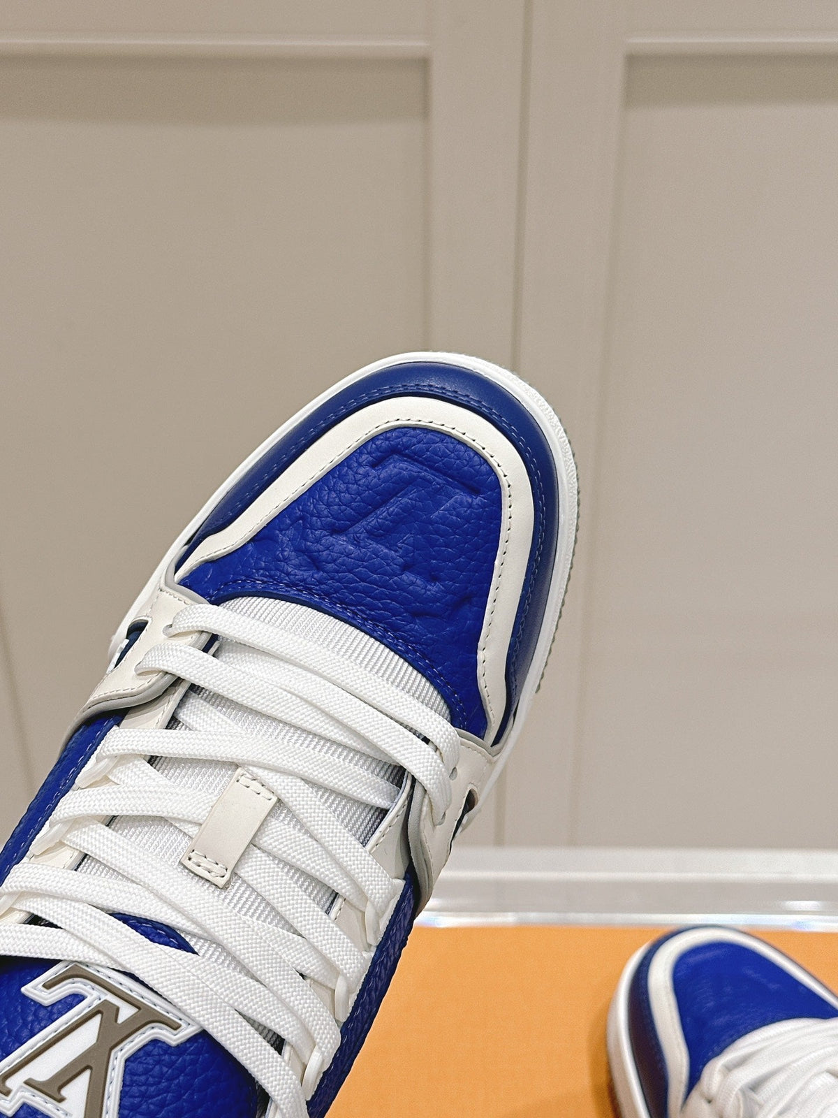 LV TRAINER SNEAKER IN GASTON BLUE GRAINED CALFSKIN