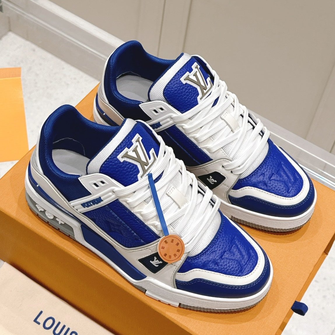 LV TRAINER SNEAKER IN GASTON BLUE GRAINED CALFSKIN