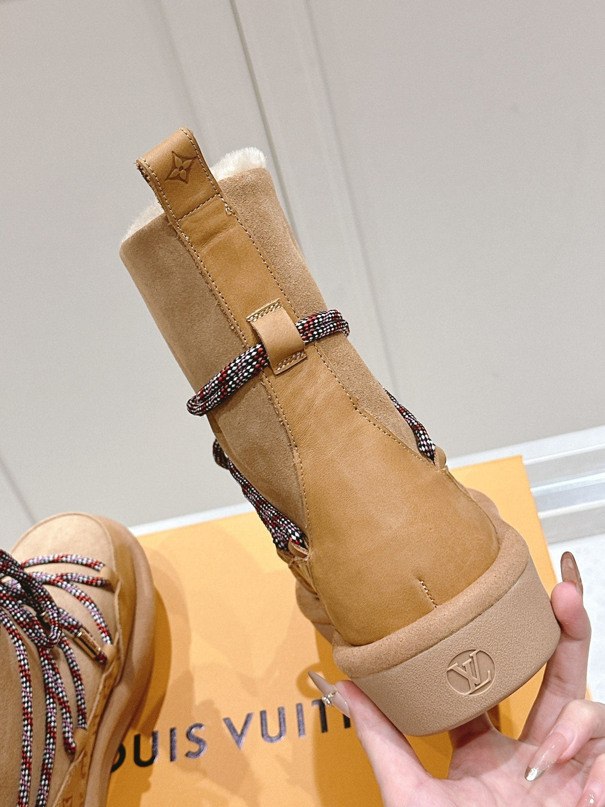 ASPEN PLATFORM ANKLE BOOT IN CIDER BROWN MONOGRAM DEBOSSED SUEDE AND SHEARLING