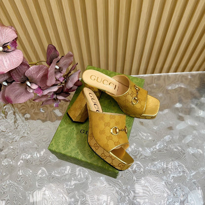 HORSEBIT SLIDE SANDAL IN GOLD MONOGRAM CANVAS AND SHEEPSKIN LINING