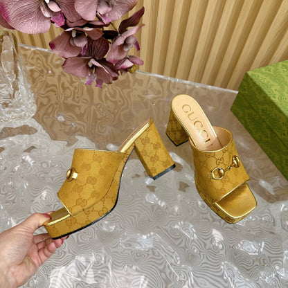 HORSEBIT SLIDE SANDAL IN GOLD MONOGRAM CANVAS AND SHEEPSKIN LINING