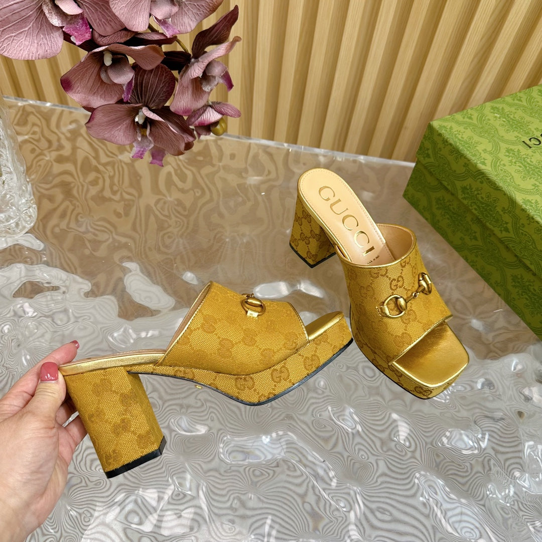 HORSEBIT SLIDE SANDAL IN GOLD MONOGRAM CANVAS AND SHEEPSKIN LINING