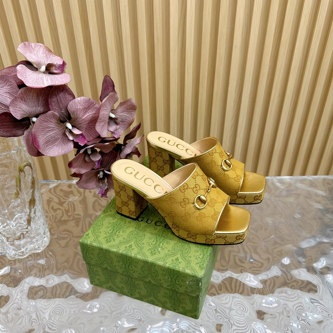 HORSEBIT SLIDE SANDAL IN GOLD MONOGRAM CANVAS AND SHEEPSKIN LINING