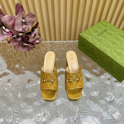 HORSEBIT SLIDE SANDAL IN GOLD MONOGRAM CANVAS AND SHEEPSKIN LINING