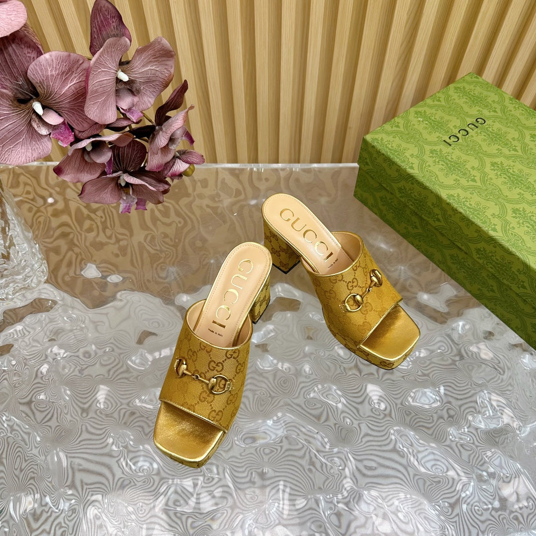 HORSEBIT SLIDE SANDAL IN GOLD MONOGRAM CANVAS AND SHEEPSKIN LINING