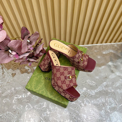 HORSEBIT SLIDE SANDAL IN WINE RED MONOGRAM CANVAS AND SHEEPSKIN LINING