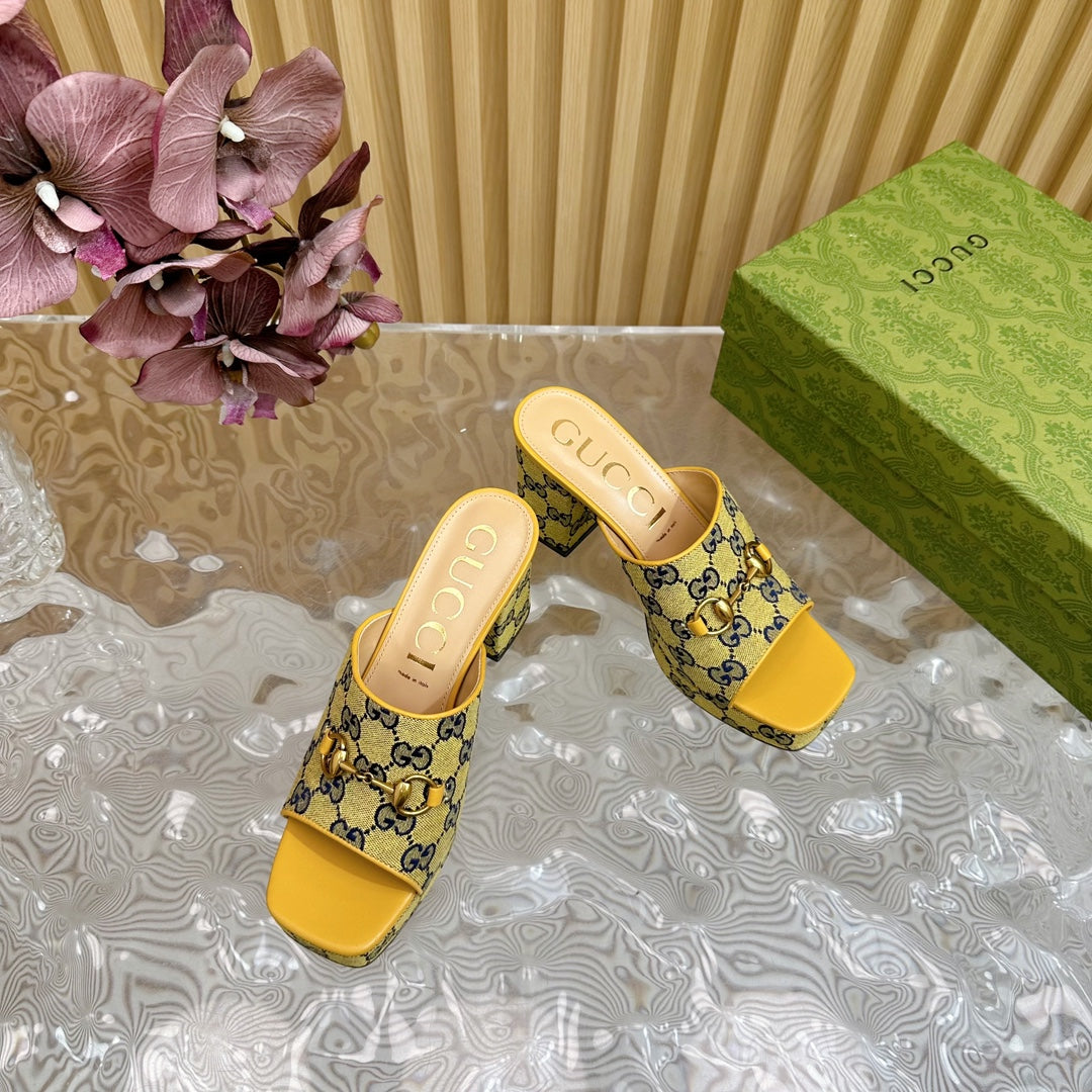 HORSEBIT SLIDE SANDAL IN TUSCANY YELLOW MONOGRAM CANVAS AND SHEEPSKIN LINING