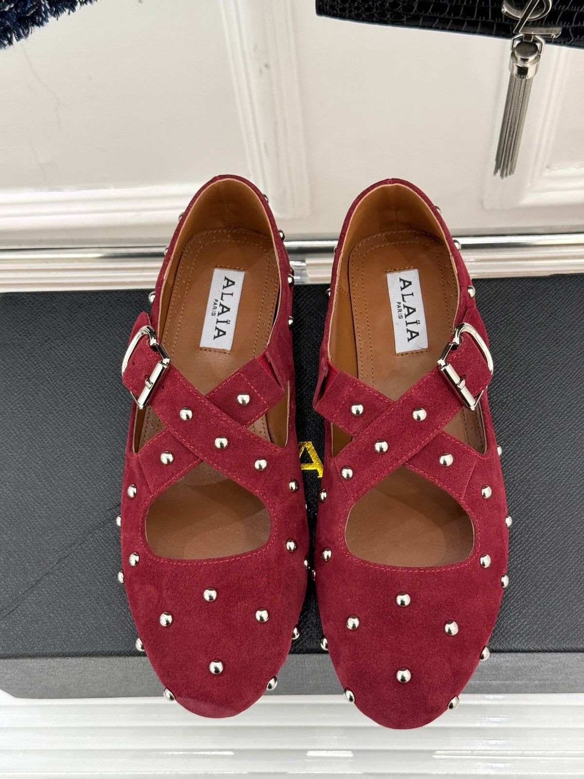 CROSSED STRAP BALLET FLATS IN BERRY RED SUEDE