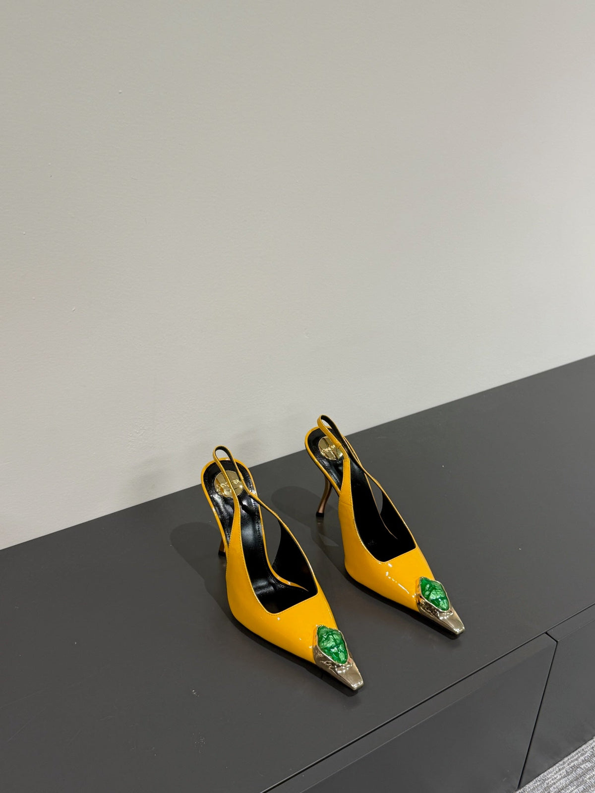 GREEN GEM-STUDDED SLINGBACK PUMPS IN YELLOW PATENT CALFSKIN