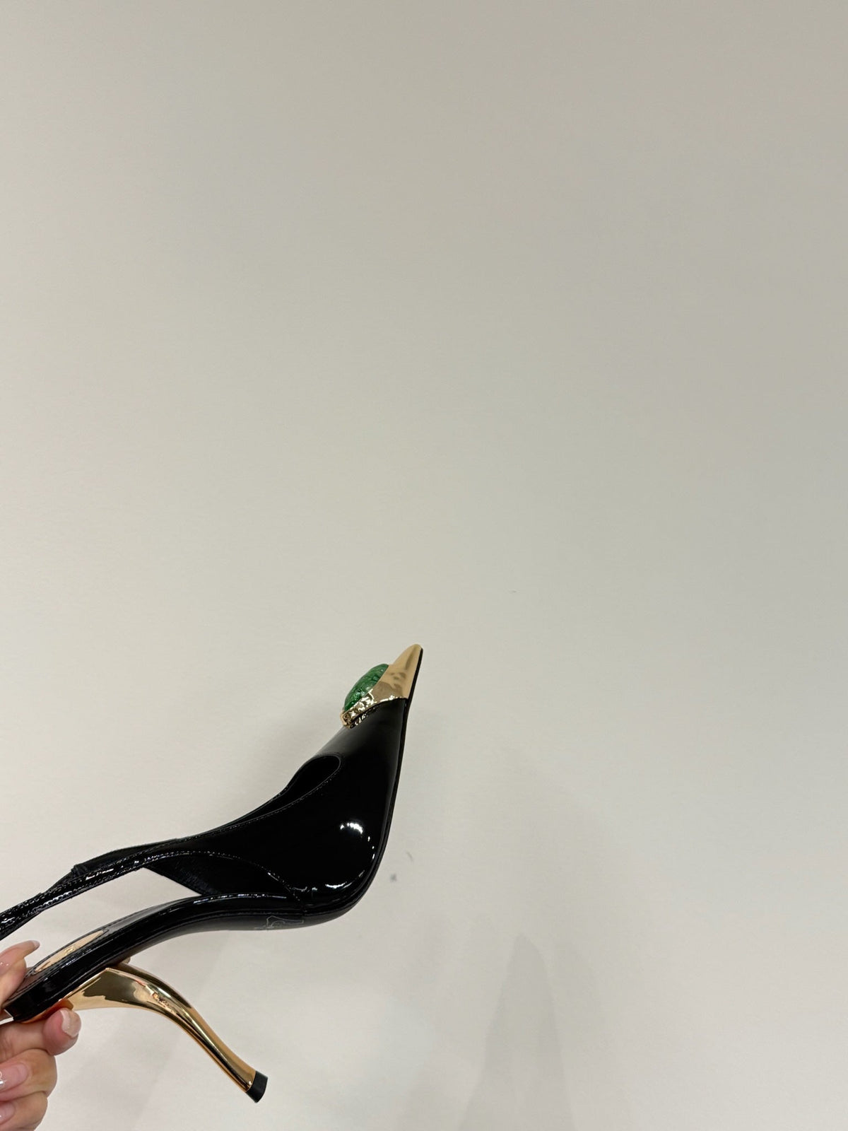 GREEN GEM-STUDDED SLINGBACK PUMPS IN BLACK PATENT CALFSKIN