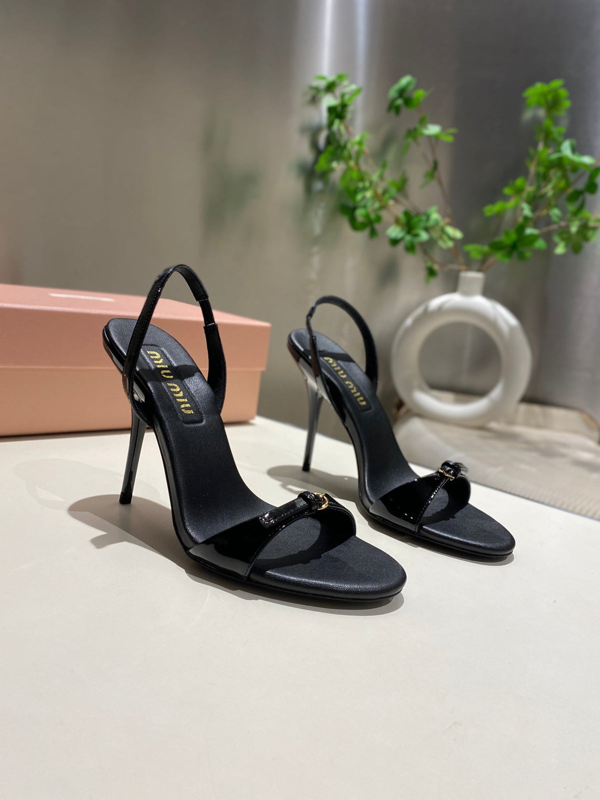 TWO STRAP HIGH HEELED SANDALS IN BLACK GLOSSY SHEEPSKIN