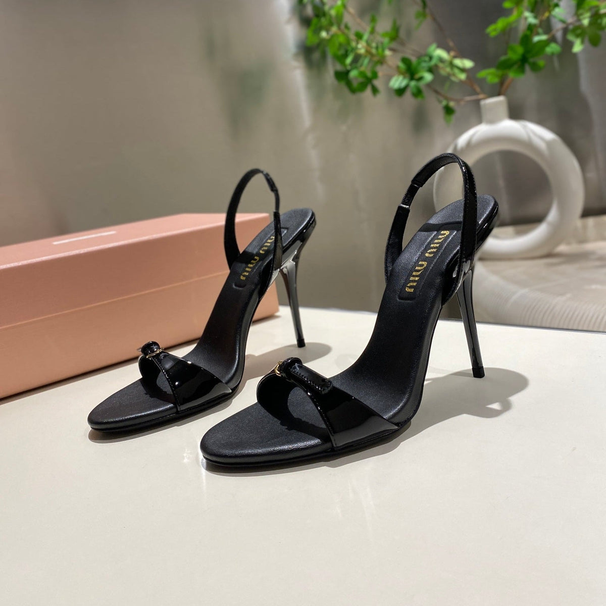 TWO STRAP HIGH HEELED SANDALS IN BLACK GLOSSY SHEEPSKIN