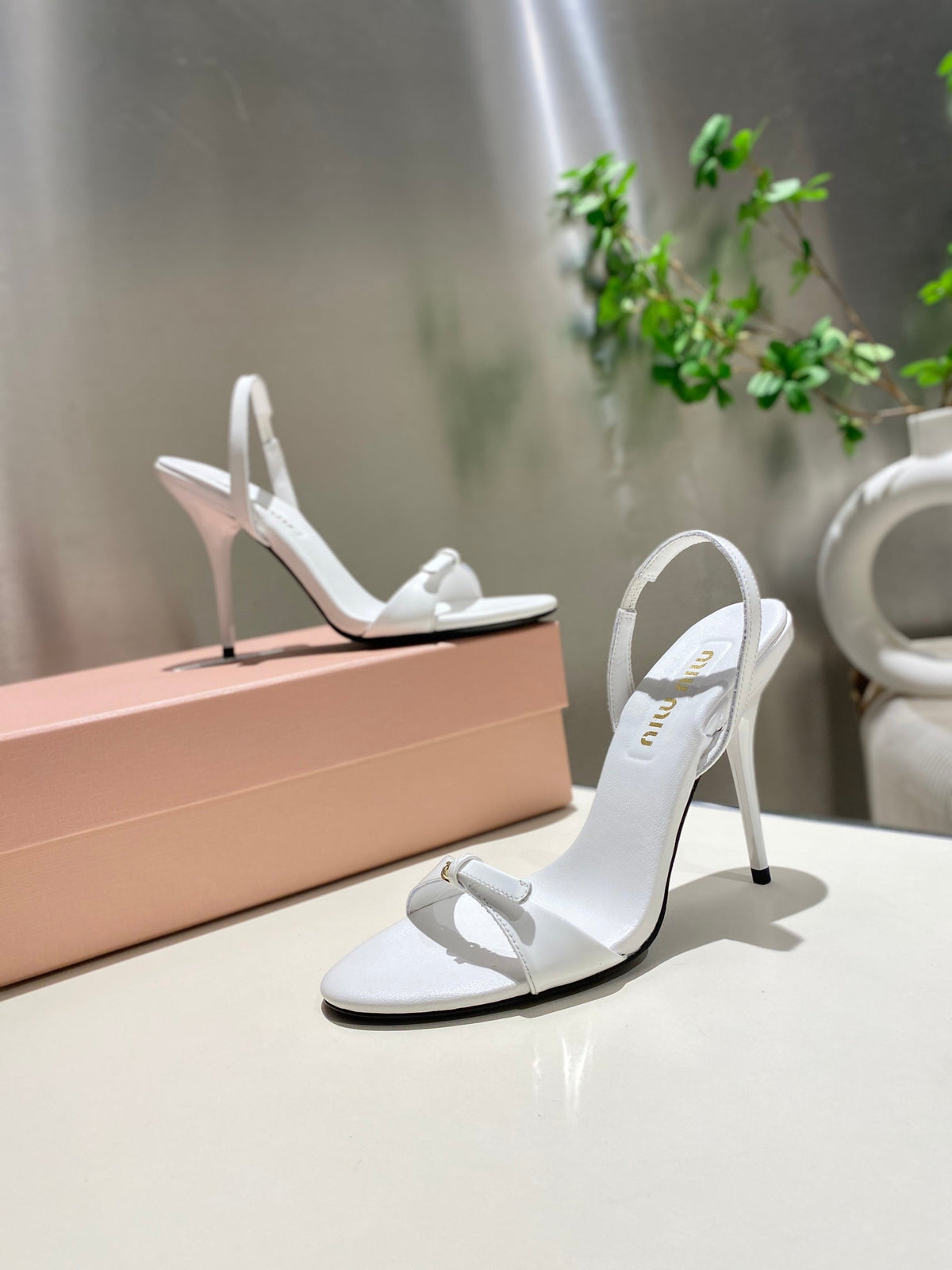 TWO STRAP HIGH HEELED SANDALS IN WHITE GLOSSY SHEEPSKIN