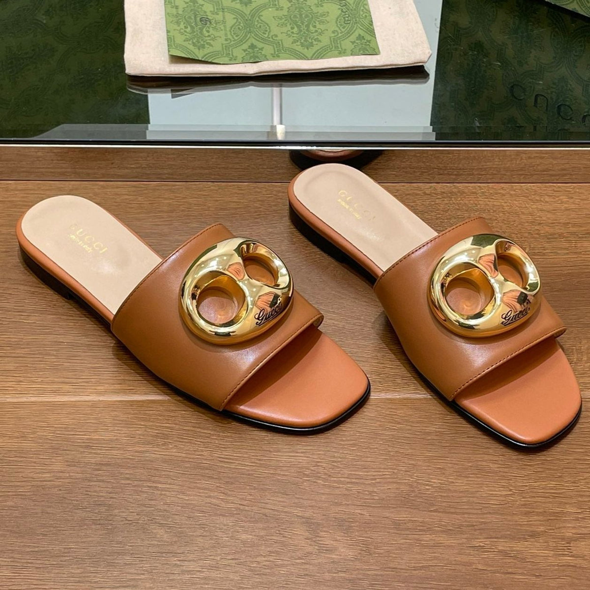 FLAT MULE IN BRONE BROWN CALFSKIN WITH GOLD HARDWARE