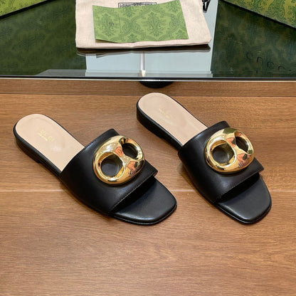 FLAT MULE IN BLACK CALFSKIN WITH GOLD HARDWARE