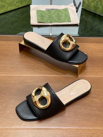 FLAT MULE IN BLACK CALFSKIN WITH GOLD HARDWARE