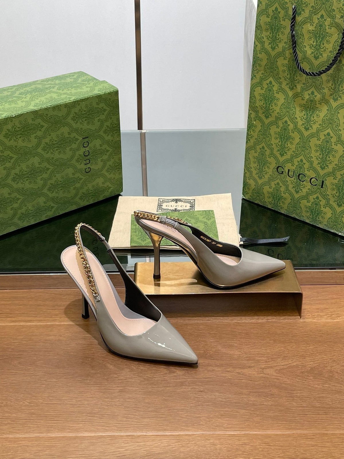 GG HIGH SLINGBACK 10.5 CM IN DOVE GREY GLOSSY CALFSKIN WITH GOLD HARDWARE