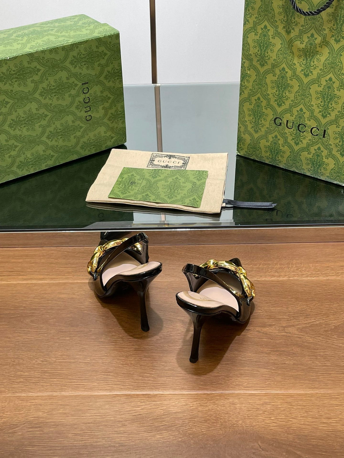 GG HIGH SLINGBACK 10.5 CM IN BLACK GLOSSY CALFSKIN WITH GOLD HARDWARE